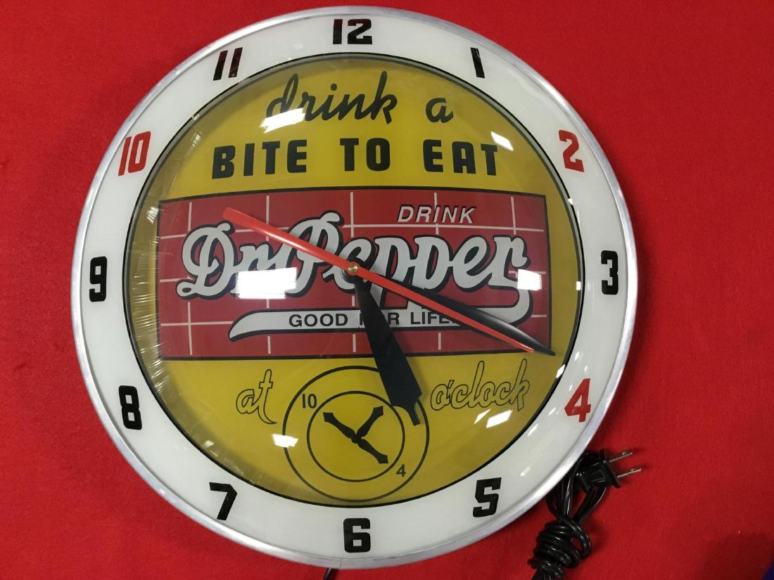 Double Bubble Dr. Pepper Lighted Clock: Drink a Bite to Eat, at 10 2 4. Reproduction, one of 425 total production. 15 Inch D, working order