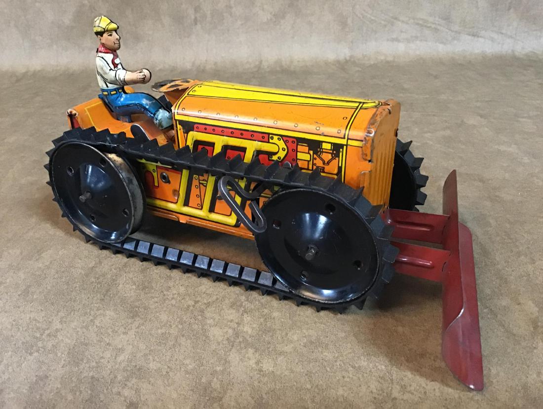 Vintage Marx Toy Tin Wind up Bulldozer: This awesome Vintage Marx Bulldozer is in working order and in VGC for age and play use. This toy has very minimal paint loss and shows very well. Agreat toy to add to your collection