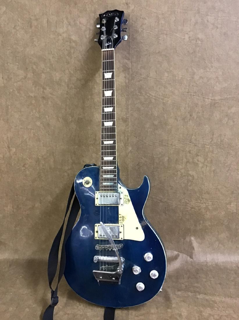 Electric Gibson Guitar: Has been custom painted at one time. Found used condition, mother of pearl in buy. Appears to have SN#245-867