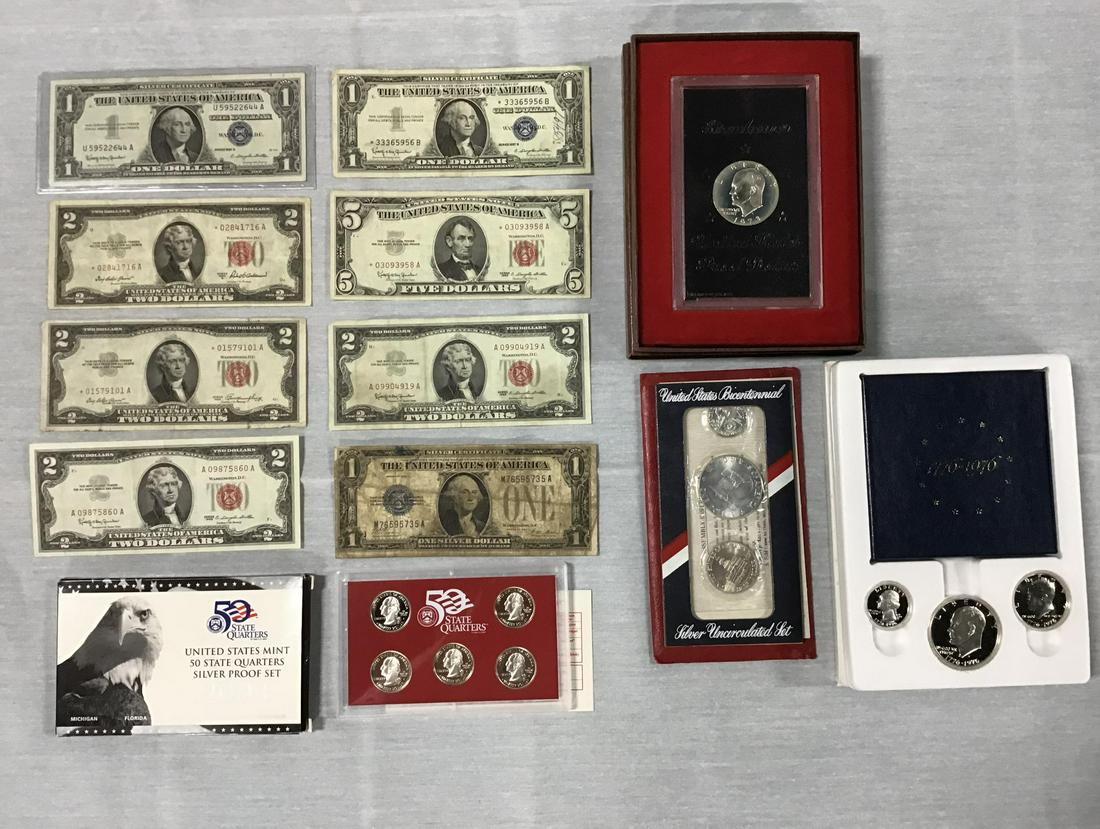 Large Lot of Currency and Coins: 3 Eisenhower Proof sets, 2004 siver proof quarter set, 1957 silver certificate, 1963- 5 dollar Red Seal Star Note, 2- 2 dollar Red Seal Star Notes, 2- 2 dollar Red Seal notes, Silver certificate Star 