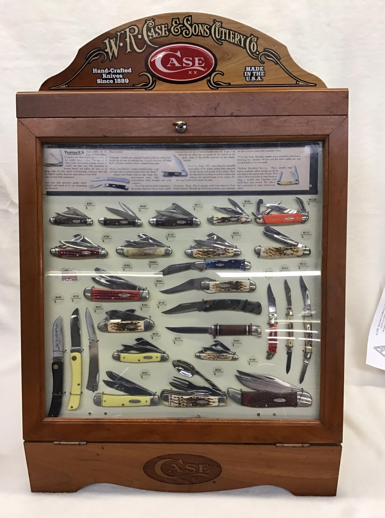WR Case and Sons Cutlery Co Pocket Knife Display, 1990s: Cherry Case, does have key, knives do have boxes, knives are all new. 29 Inches T x 19.75 Inches W x 12.5 Inches D.