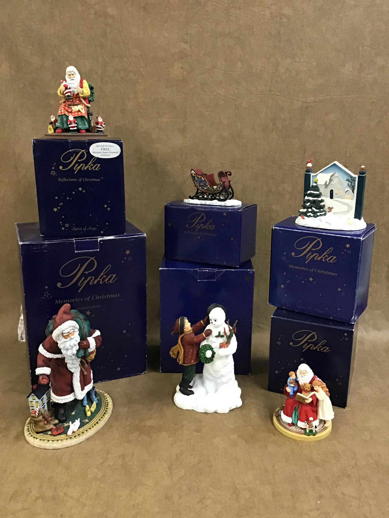 Lot of 3 Pipka Figurines: SN# 13928-#3246/4500, SN# 11353-#1378/9700, SN# 13716-#98/6500, and 3 small figurines. Like new in box