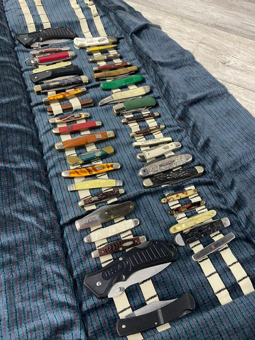 LOT OF 39 VINTAGE POCKET KNIVES IN ROLL UP CASE: BARLOW, CASE, SCHRADE, FIGHTING ROOSTER, BUCK, AND OTHERS. VG TO USED FOUND CONDITION