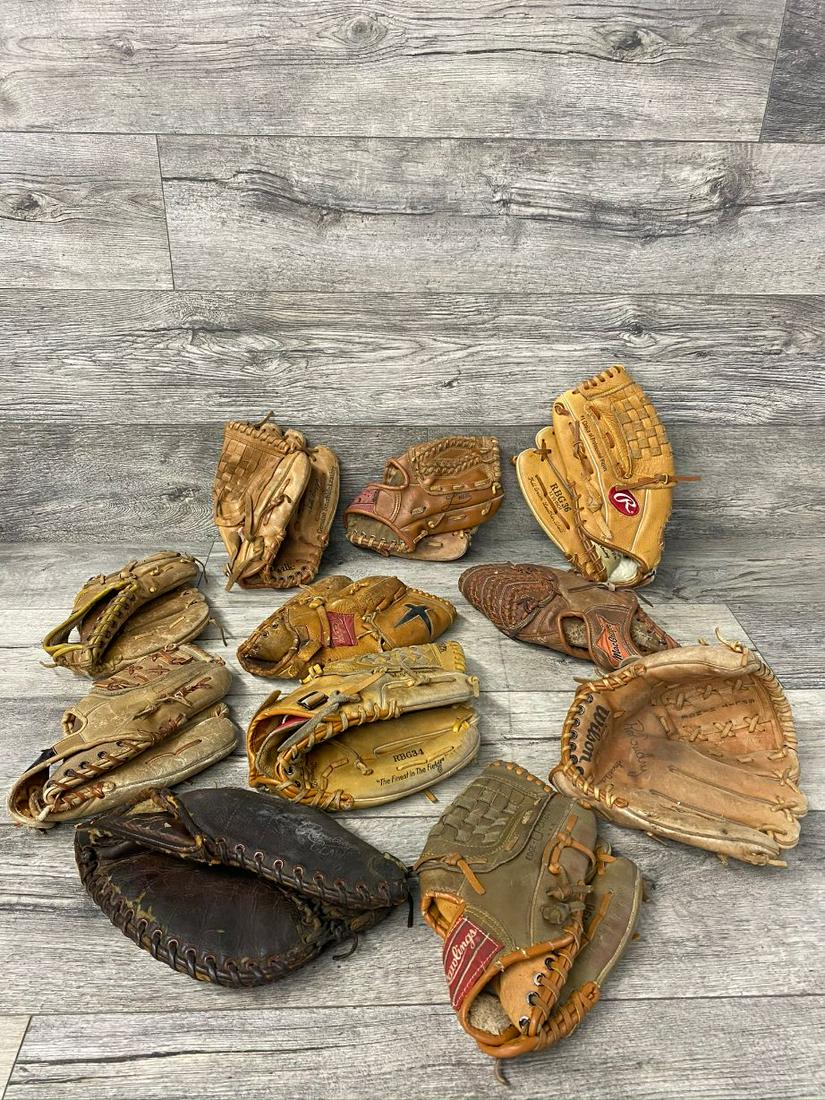 LOT OF 11 VINTAGE BASEBALL GLOVES: KEN GRIFFEY JR., WILLIE MAYS, WADE BOGGS, NOLAN RYAN, BROOKS ROBINSON, CATFISH HUNTER, RON GUIDRY. FOUND CONDITION