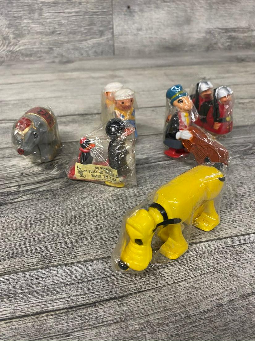 LOT OF NOS NO WINDING INCLINE WALKING TOYS: PLUTO, JIMMY CRICKET, PENGUINS, ELEPHANT, AND OTHERS. NEW FOUND CONDITION