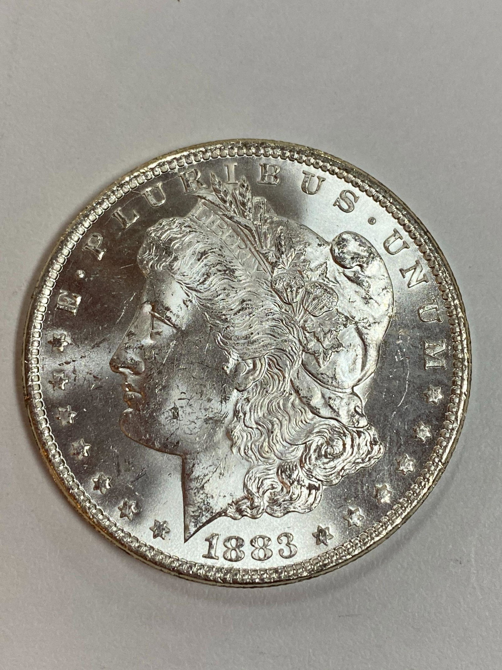 1883 CC MORGAN DOLLAR: HIGH GRADE