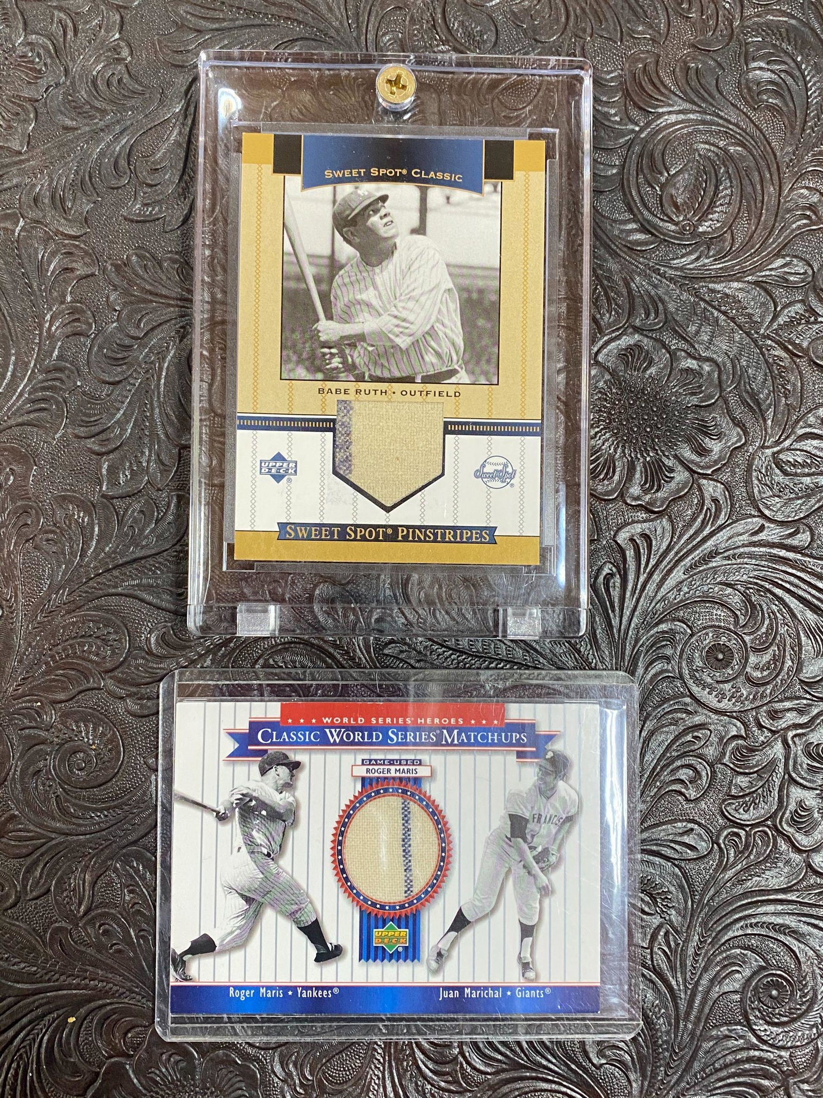 Upper Deck Babe Ruth and Roger Maris Jersey Cards: Upper Deck MU62 Classic World Series Matchups Roger Maris wool uniform swatch with pinstripe, and Upper Deck SP-BR Sweet Spot Pinstripes Babe Ruth wool uniform swatch with bold pinstripe. SOLD AS IS. 