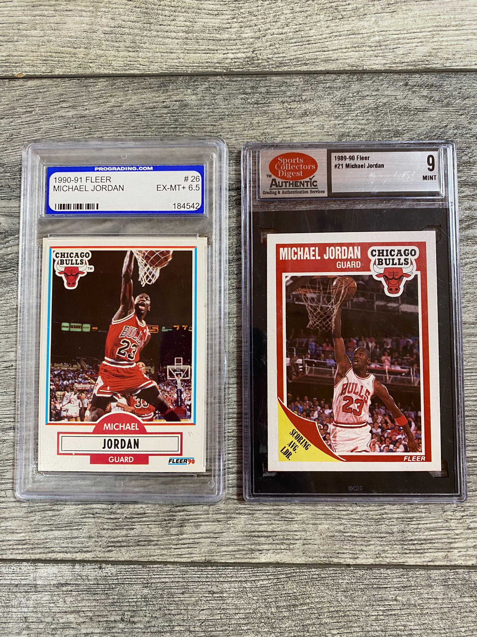 Lot of 2 Graded Michael Jordan Cards: 1989-90 Fleer #21, SCD 9 Mint & 1990-91 Fleer #26, Prograded EX-MT+ 6.5. SOLD AS IS. BUYER ASSUMES ALL RISKS AND RESPONSIBILITY, WE CANNOT GUARANTEE OR AUTHENTICATE