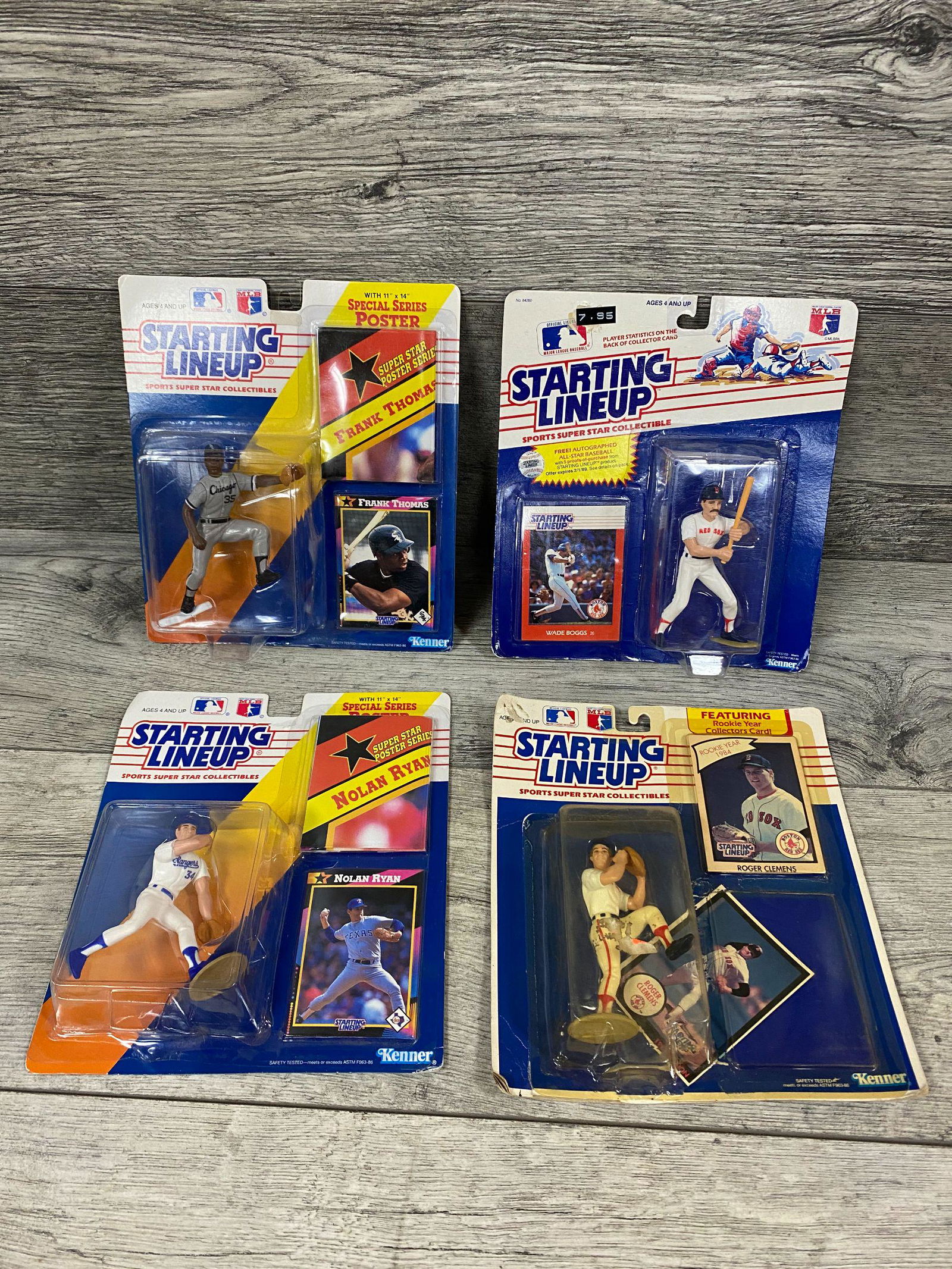 Four 1988 Starting Lineup Figurines: and accompanying cards by Kenner in unopened blister packs: Frank Thomas, Wade Boggs, Roger Clemens, Nolan Ryan. Figurines/cards (M); boxes (EX).