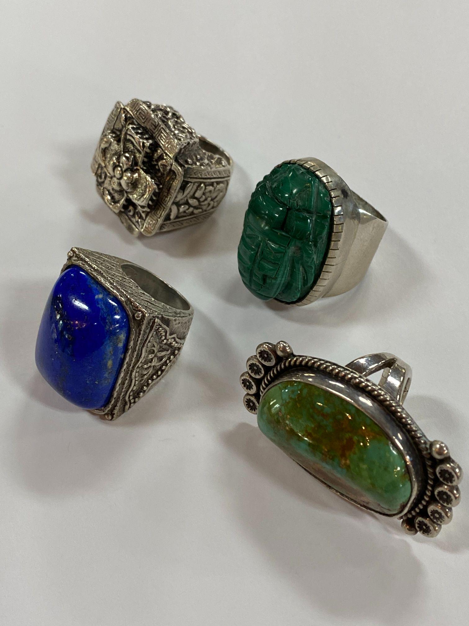 LOT OF 4 VINTAGE STERLING SILVER RINGS: TURQUOISE, BLUE LAPIS LAZULI, ETC. SIZES 7, 7.5, 6.5, AND 1 ADJUSTIBLE. VG FOUND CONDITION