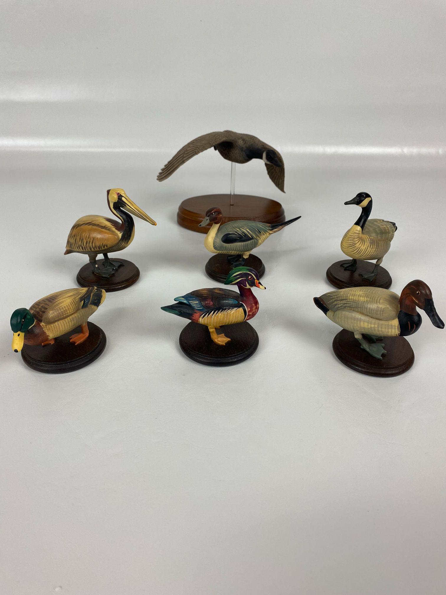LOT OF 7 SMALL HAND PAINTED COLLECTORS BIRDS: 6- WOOD HEAND CRAFTED BIRDS, 1- HAND PAINTED RESINWOOD GOOSE ON STAND. EXC ESTATE FOUND CONDITION