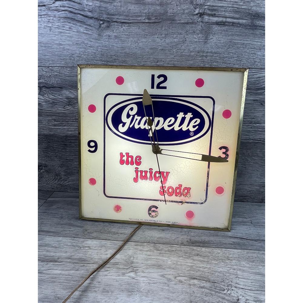 PAM Clock Inc., Grapette Lighted Clock: Lights up and keeps time. Found cond. 15.25 x 15.25