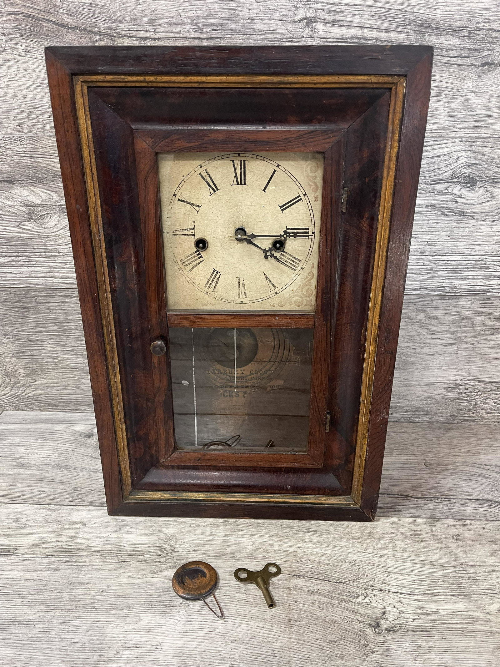 WATERBURY MINATURE CLOCK: KEY AND PENDULUM INCLUDED