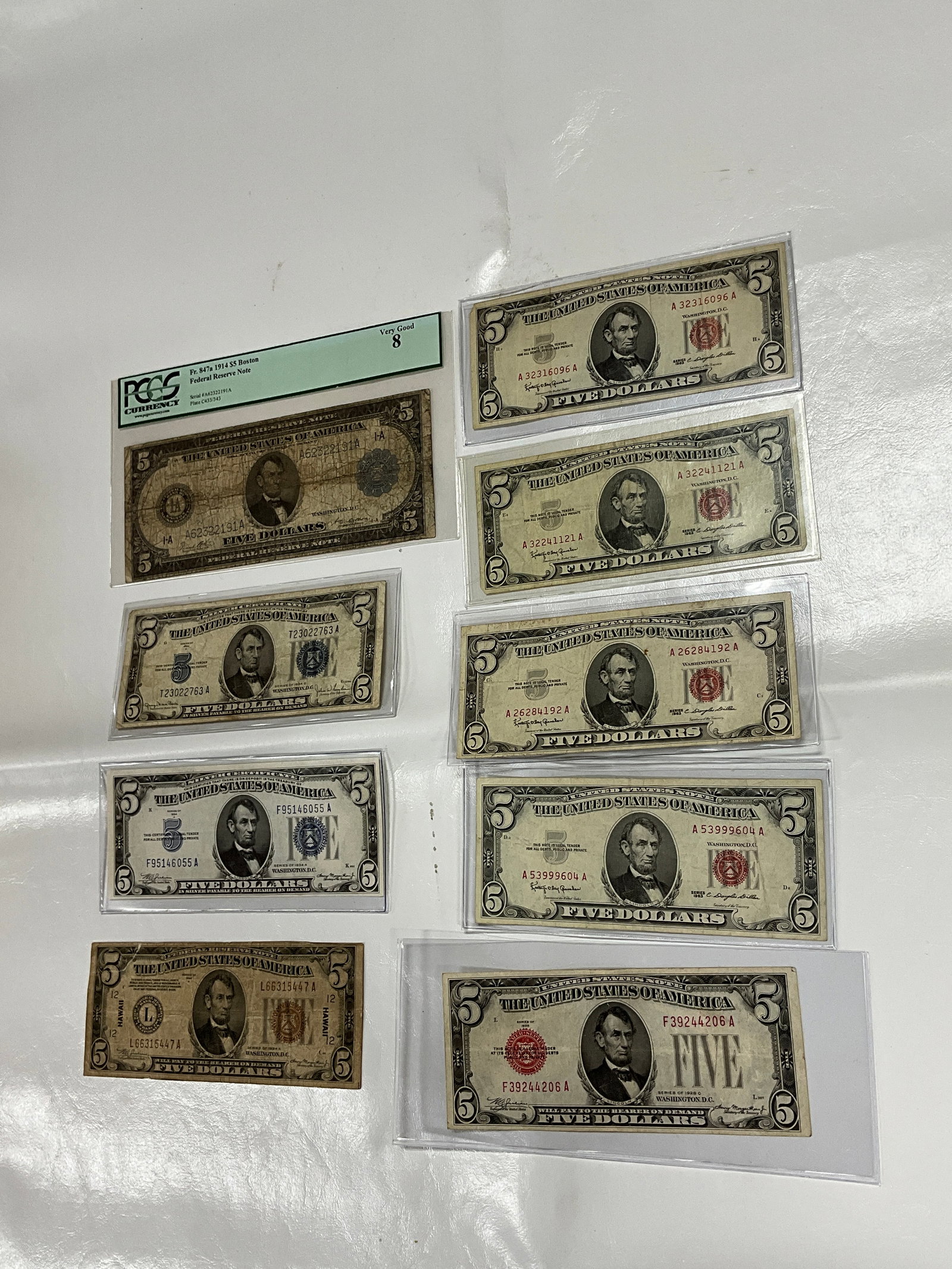 LOT OF 9 $5 FEDERAL NOTES: 4 RED SEAL FIVES, 2 BLUE SEAL FIVES, HAWAII FIVE, AND PORKHOLE FIVE