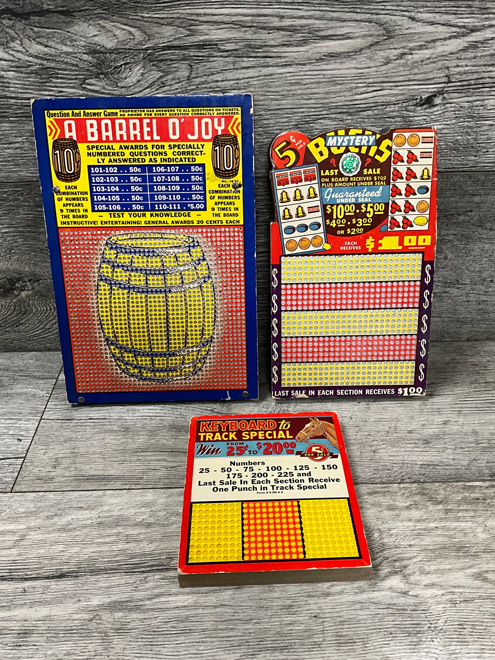 3 - VINTAGE PUNCH BOARDS: KEYBOARD TO TRACK SPECIAL, A BARREL O' JOY, MYSTERY BUCKS