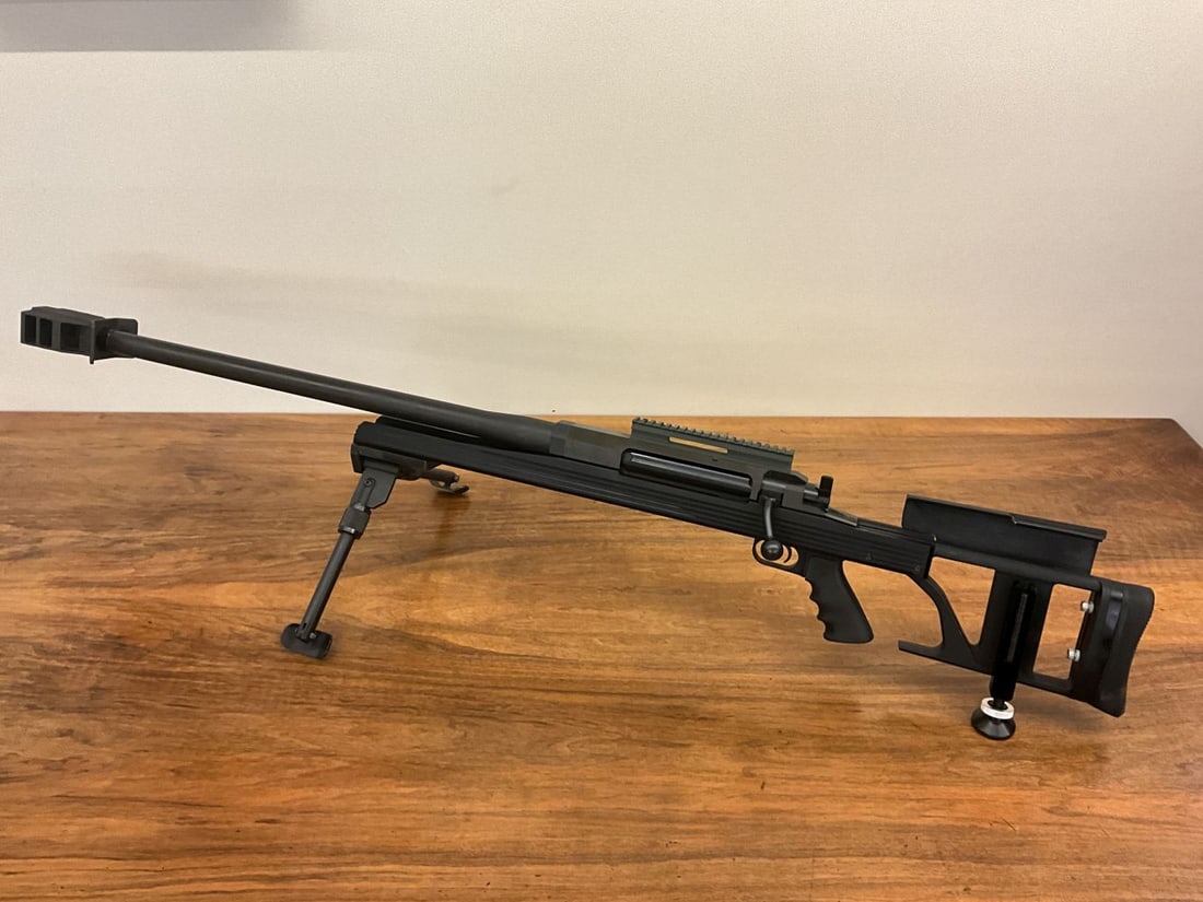 Armalite AR-50 AIL Left Handed Bolt Action: Single shot bolt action with adjustable stock. Synthetic with bipod. 30 " Barrel and massive muzzle brake.