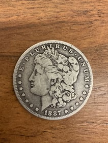1870-O Morgan Dollar