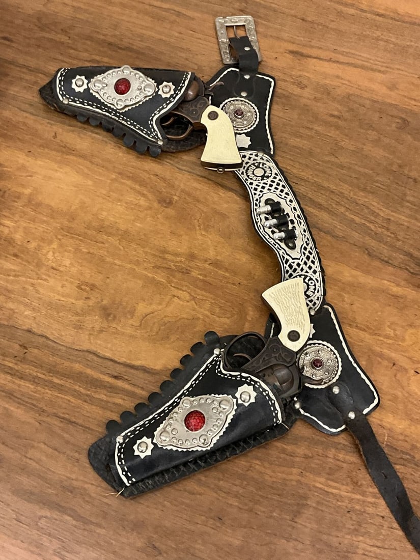 Bronze Finish Actoy Lone Ranger Cap Guns And Holster: Leather studded holster. Action is weak on one cap gun