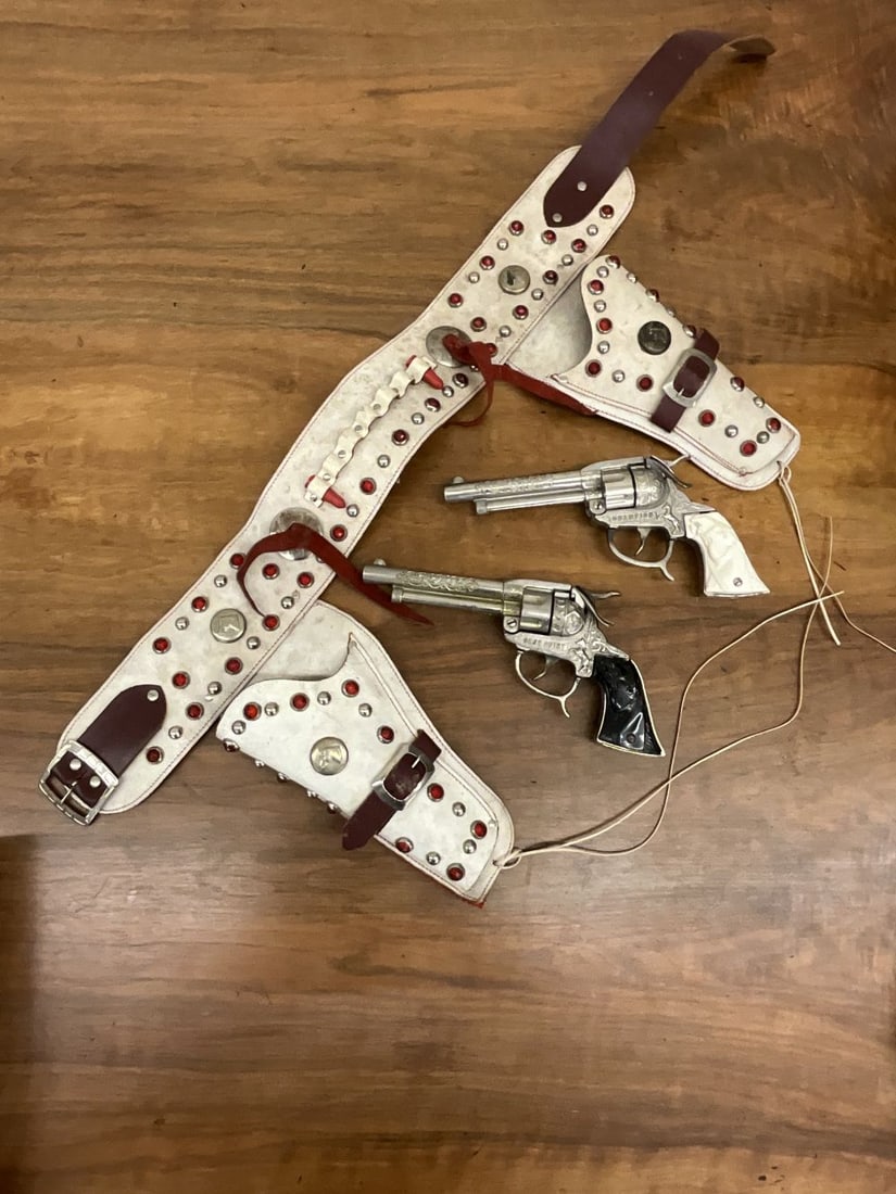 Vintage Gene Autry and Champion Cap Guns With Studded Holster: Trigger action good. White leather studded holster and belt