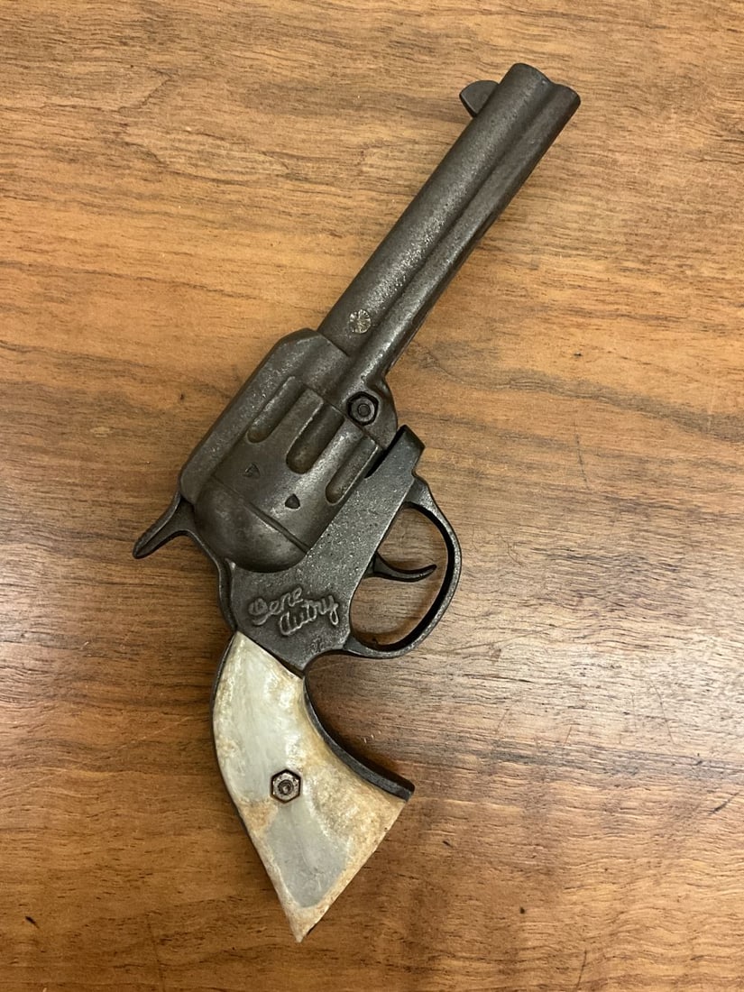 Gene Autry Cast Iron Cap Gun Toy: Cast iron, no orange plug. Some warp to grips