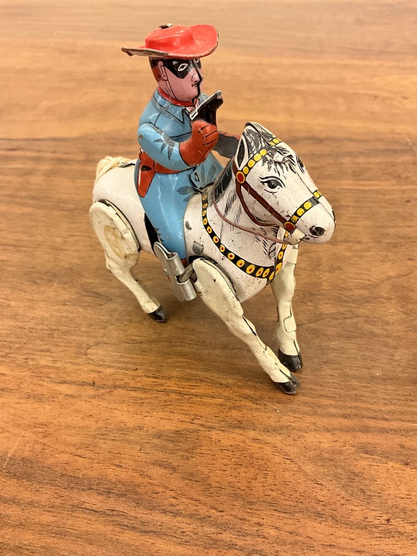 1950's Kokyu Japan Lone Ranger Tin Wind-up Toy: Masked bandit Lone Ranger on horse. Working order- has reins and tail