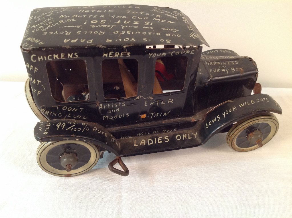 Tin Litho Wind Up Marx Limping Lizzie Jalopy Car Toy: Vintage Tin Litho Wind Up Marx Limping Lizzie Jalopy Car w/Driver & Spare Tire. Has Funny Sayings Lithographed on the Car. In Working Condition. Measurements: 4" Tall x 7" Long