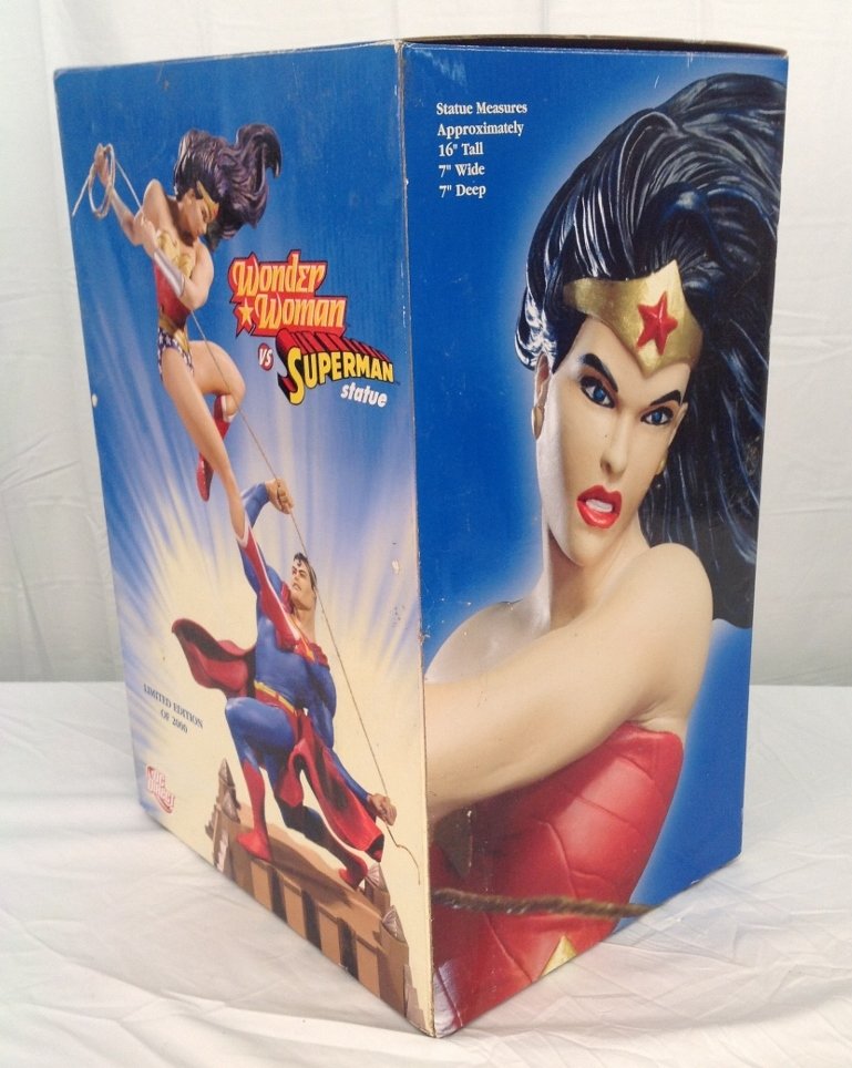 Wonder Woman Vs Superman Statue by DC Direct 1412/2000: Wonder Woman Vs. Superman Hand Painted Cold-Cast Porcelain Statue by DC Direct. Sculpted by Ray Villafane and Numbered 1412/2000. Item Comes with Original Box.
