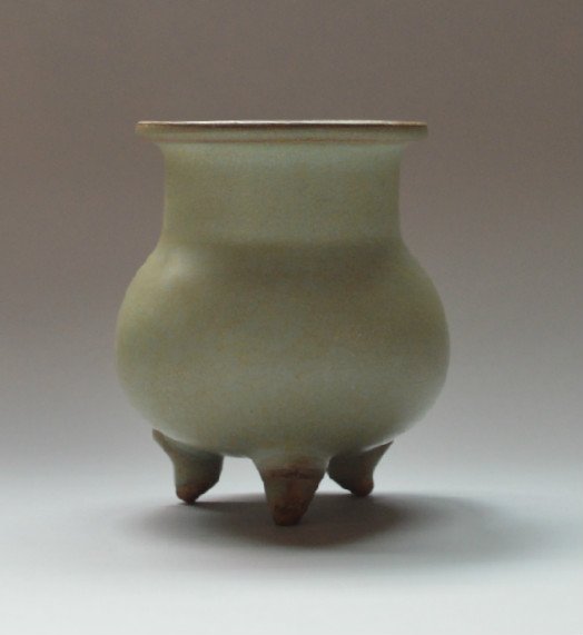 Song Ming Dynasty Jun Kiln Thee Foot Censor: Greenish blue glaze all over, the tall neck leading to an everted rim, the edge burnt brown in the firing, the 3 feet left unglazed. 4 inches high.