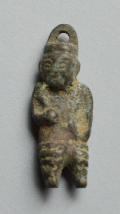 Archaic Bronze Lucky Court Official Pendant: A bronze good luck figure for success of a court official with pantaloons, Tang Dynasty hat and vest holding an object in his right hand, rich reddish brown patina with green and rust spots, 1.5 inche