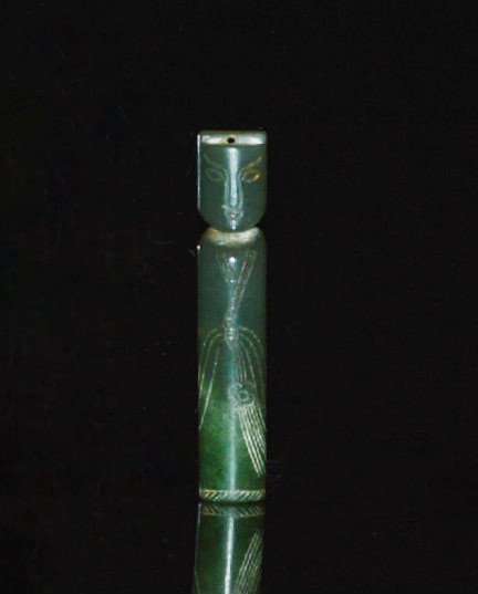 A Han Dynasty Green Jade Court Official Chop: A blank chop in the shape of a figure of a Han court official. 2 inches high.