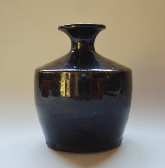 Ming Dynasty Ding Kiln Black Glaze Wine Jar: Thick dark chocolate orange peel glaze all over except for a roughly cleaned foot rim. 7 inches high. Consignments wanted! contact Suppinger's at Suppingers.com.