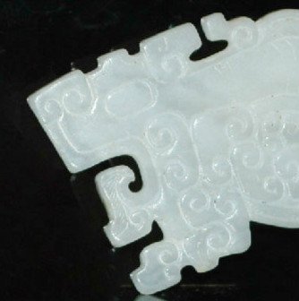 A Ming Dynasty Archaic White Jade Tiger and Dragon (1 of 4)