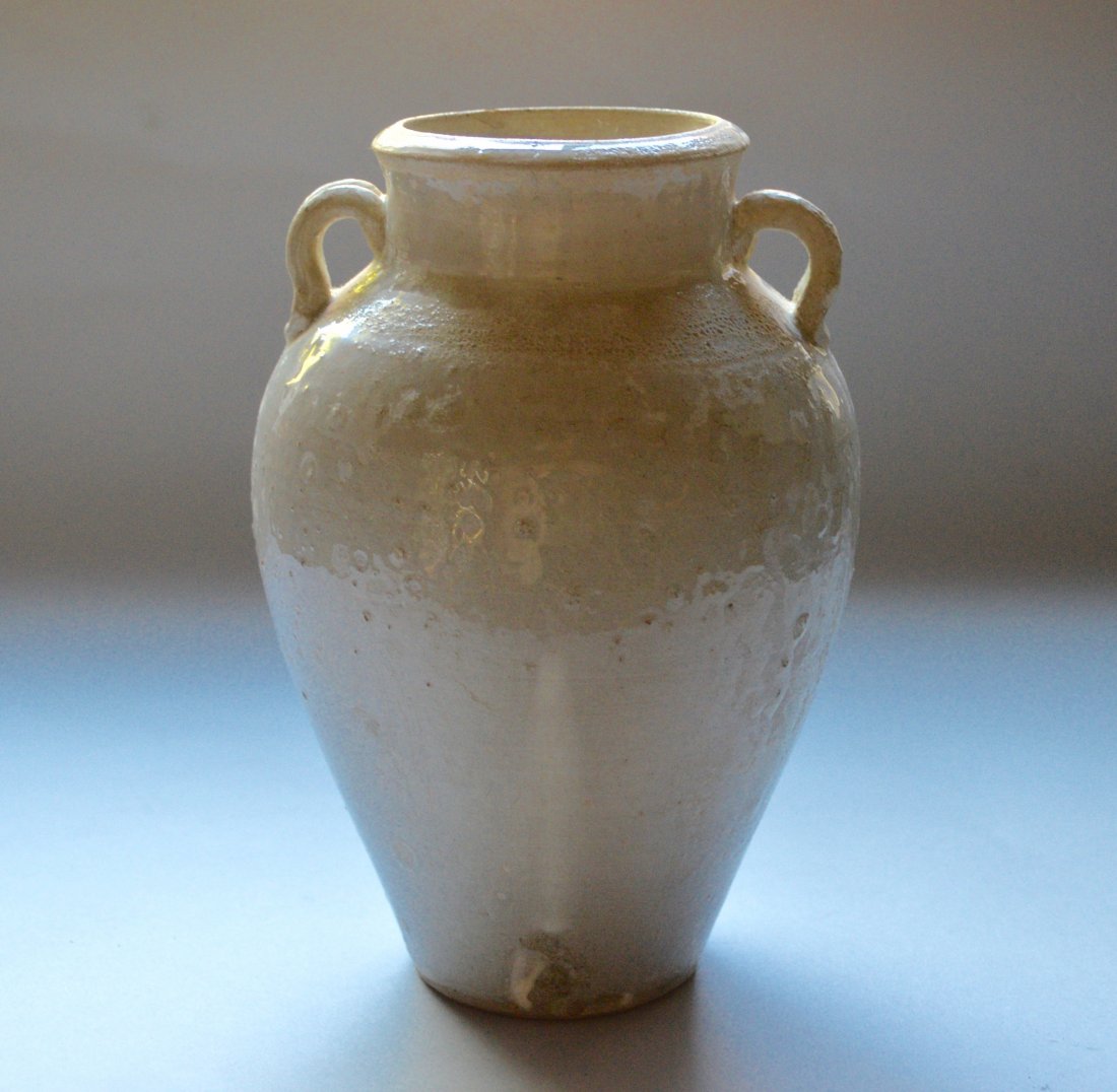 Wei Song Dynasty Straw Glazed Jar: Stoneware, two handles and large open mouth, the straw color glassy silicon opaque glaze covering a white slip, flat foot with white slip, potters marks, 10 inches high.