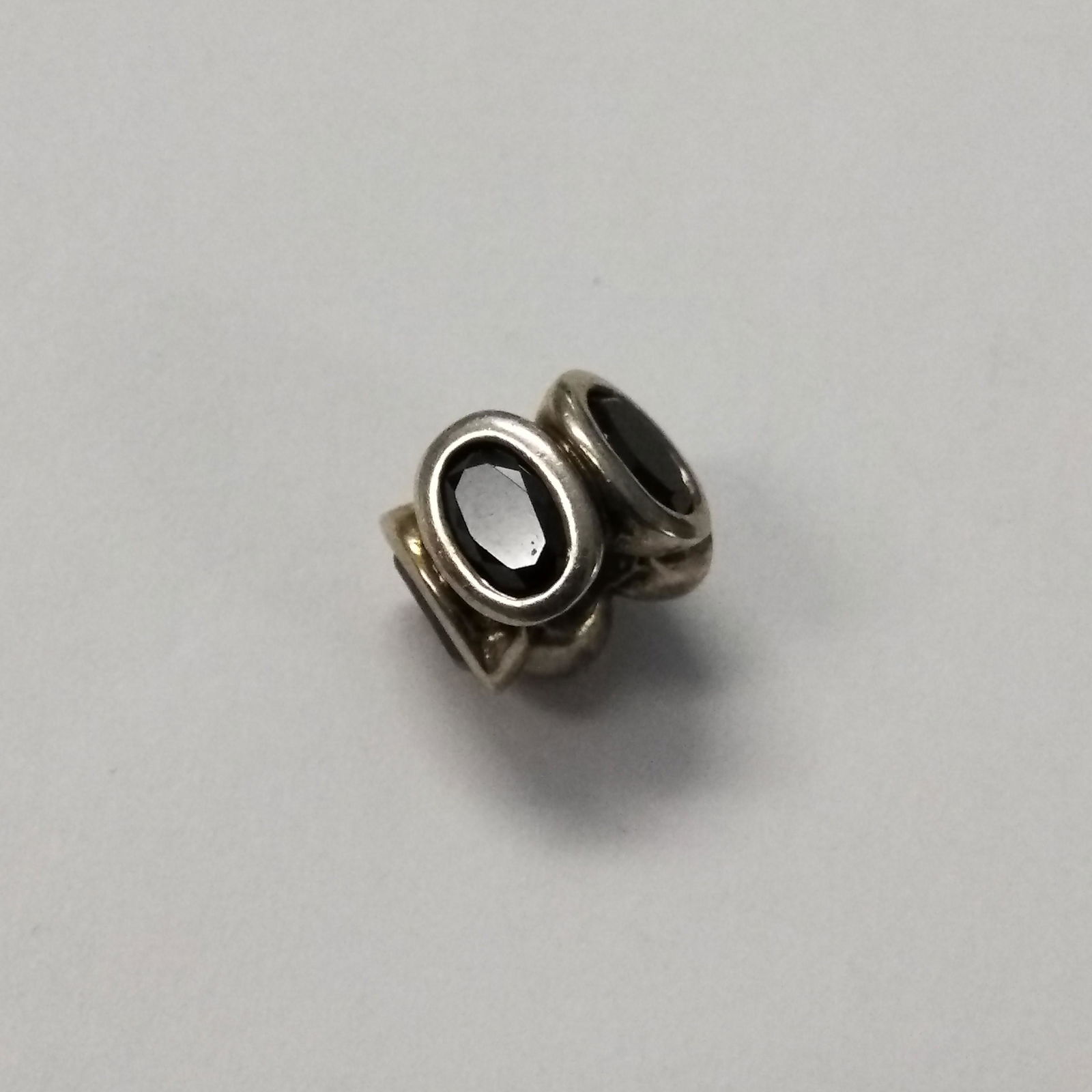925 Silver Pandora Charm with Gems .10 ozt: 925 Silver Pandora Charm with Gems .10 ozt Hallmarks on the charm: 925 ALE (meaning 925 Silver, ALE is founder's father) Pre-owned jewelry may contain minor markings/imperfections throughout.