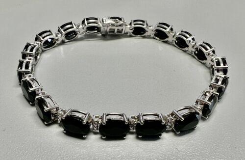 Sterling Silver Black Corundum / Diamond Bracelet: Sterling Silver Black Corundum / Diamond Bracelet weight: 13.2G Length:7.25" Clasp closure Composition: Sterling Silver (.925)