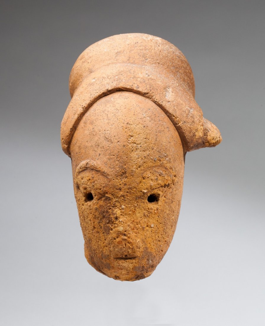 Nok young dignitary head: orranged terra cota. Nok, Nigeria, 500 BC - AD 500. 14x8,8x8cm