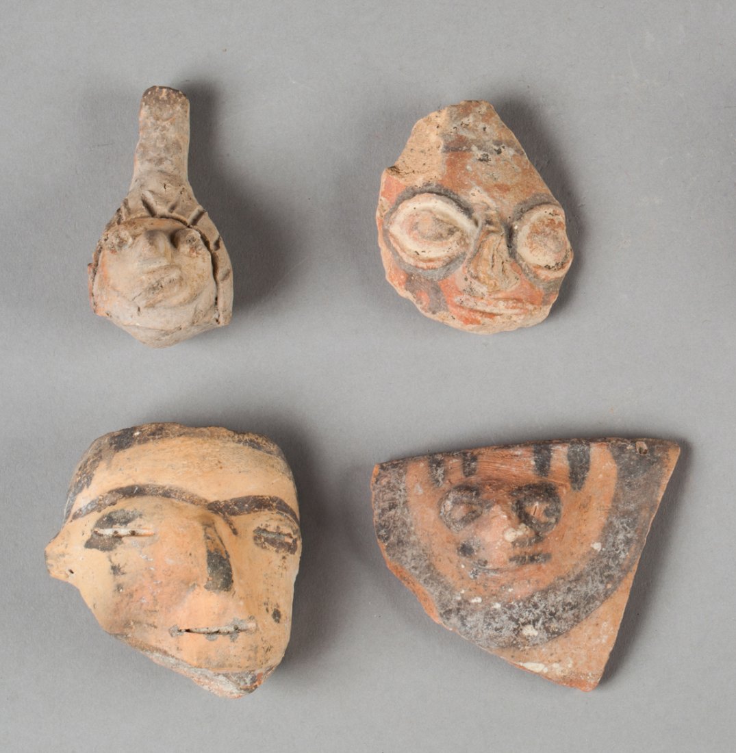 Three Huaxtec heads and a Colima Ocarina.: Terra cotta. Huaxtec, Mexico, AD 500-950 and Colima, Western Mexico, 100 BC - AD 250. 6,5 - 5 - 6 - 5,5cm. Provenance : German private collection, ex Ferdinand Anton