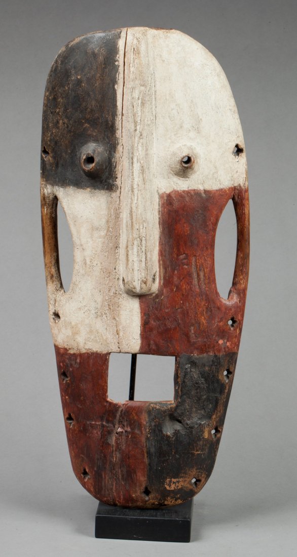 Itruri mask: Polychrome wood, traces of use. Itruri, D.R. of Congo. 53x25cm. Provenance : Ex Jean Claude Toulon, Paris.