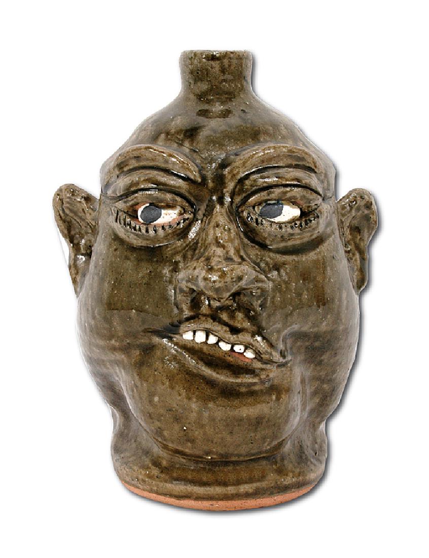 Lanier Meaders. Dark Iron Deposit Glazed Face Jug. (1 of 6)
