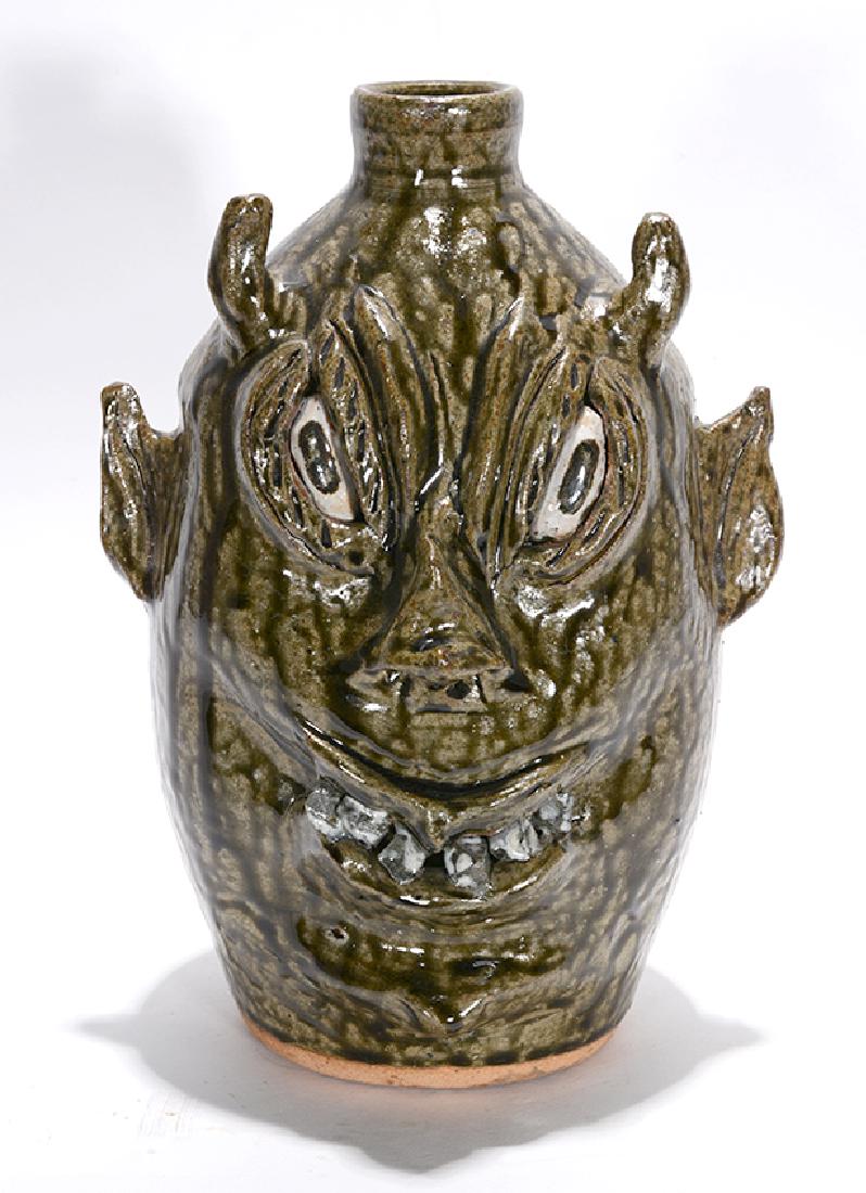 Cleater and Billie Meaders. Rock Tooth Devil Face Jug.: Cleater and Billie Meaders. Rock Tooth Devil Face Jug.1991. Signed and dated. Mint condition. 11.5"h. Est. $200-400. Ship: $45