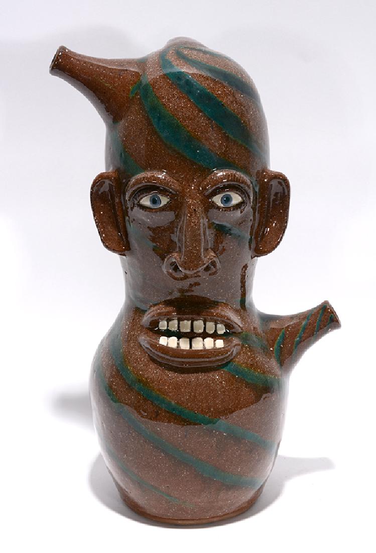 Joe Reinhardt. Two-Color Swirl Double Spout Face Jug. (1 of 3)