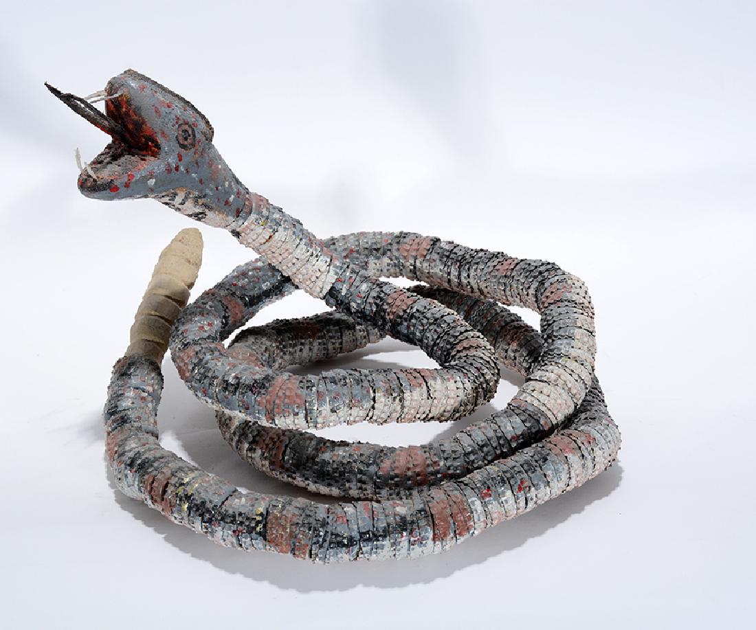 Felipe Archuleta. Bottlecap Snake. (1 of 2)
