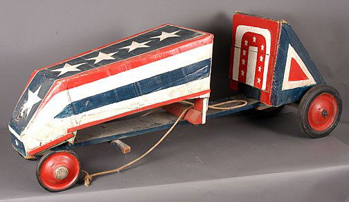 Anonymous Soap Box Derby Racer: c. 1940's-1950's. Found near Griffin, GA. Replica with rope steering. Made primarily of painted cardboard and wood. Old. Working condition. 58" long x 20.5"t x 15.5"w. Provenance: Howard Campbell. Est