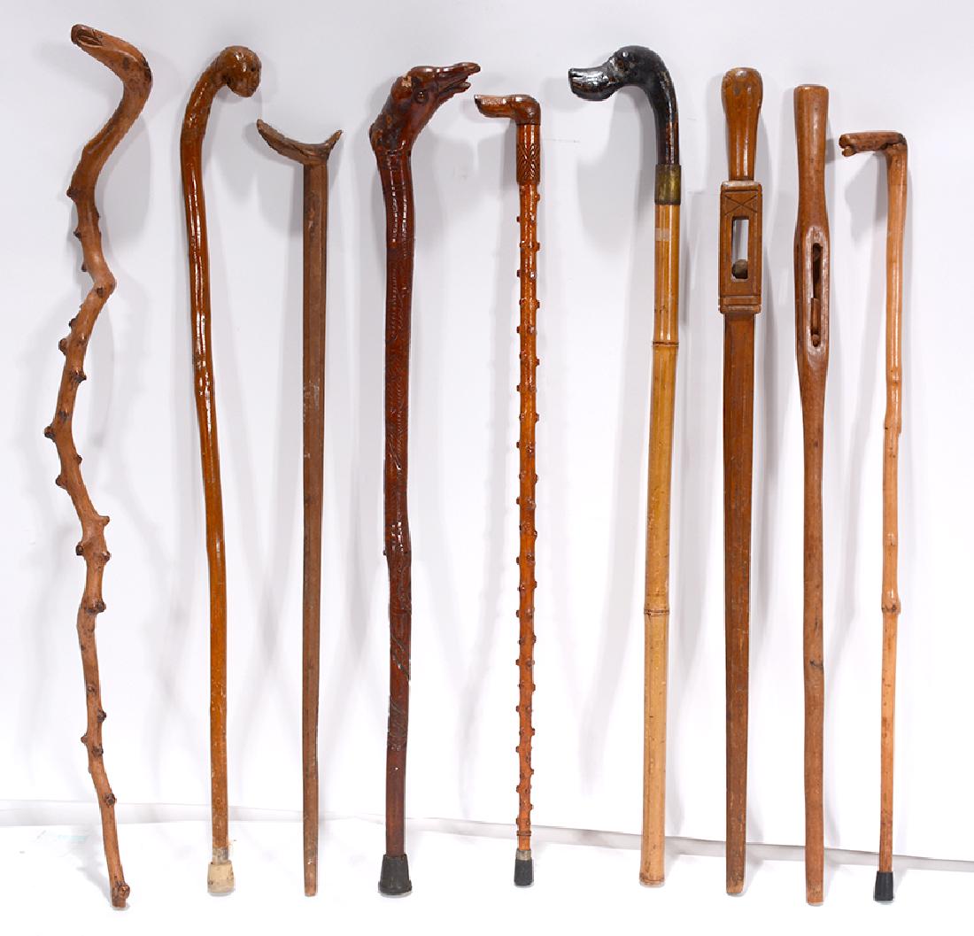 9 Carved Wooden Canes. (1 of 3)
