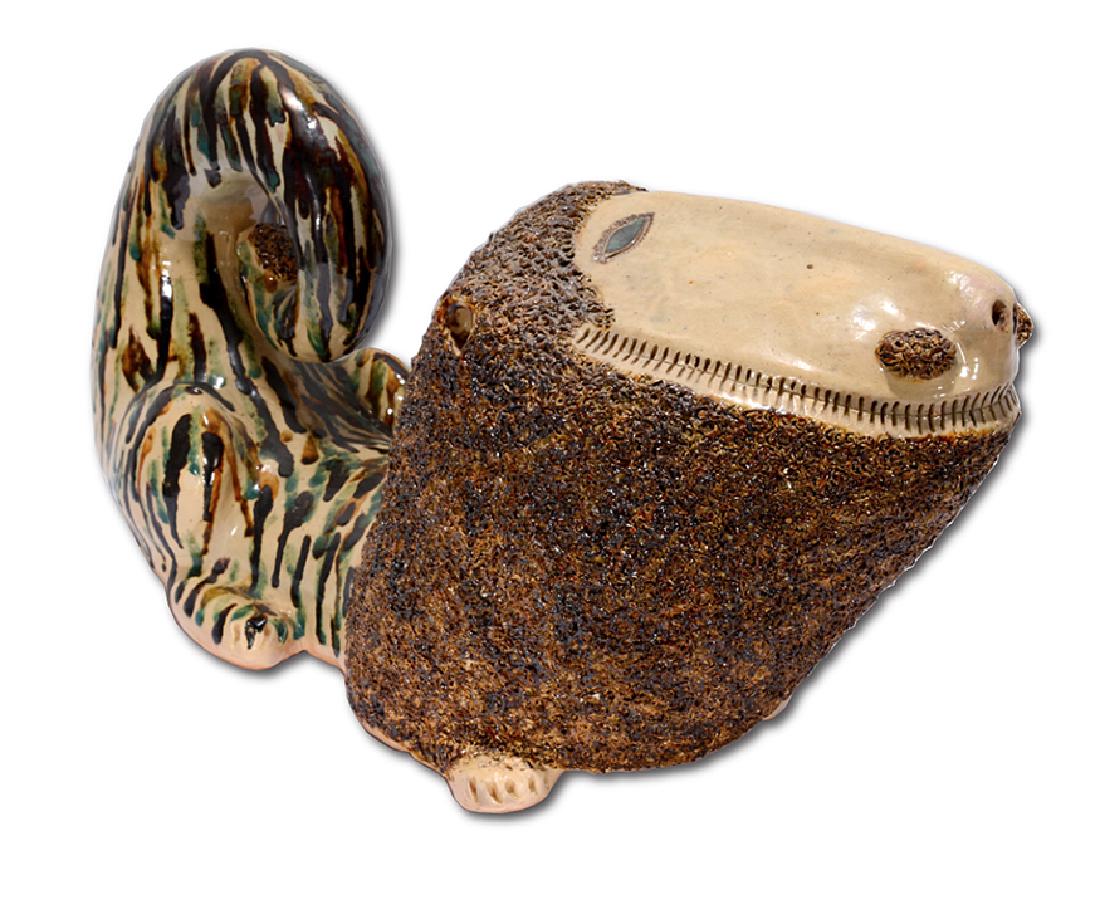 Bill Ray Hussey. Extra Large Reclining Lion, #35.: Bill Ray Hussey. Extra Large Reclining Lion, #35. Initialed and numbered. Multi-colored drip glaze. Minor kiln cracks on side, otherwise excellent condition. 22" long x 12" h x 8" w. Est.