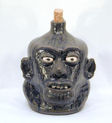 Lanier Meaders Rock Tooth: early 1970's. Rich tobacco-spit glaze. Expressive face. 10" h. Mint condition.Provenance: Chuck and Jan Rosenak.