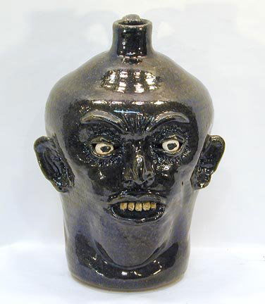 Lanier Meaders Face Jug: Large Traditional Face Jug, circa late 1970's. Clay teeth 12" h. Mint condition. Provenance: Pria Harmon Collection.