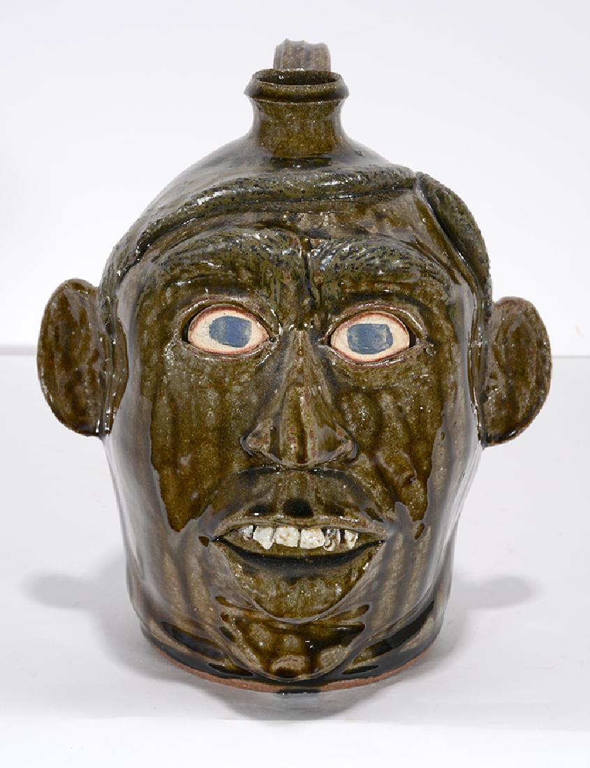 Michael Crocker. Tribute To Lanier Meaders.: Michael Crocker. Tribute To Lanier Meaders. 2002. Signed and dated. Rock tooth, full head of hair. Mint condition. 10" h. Est. $200-400. Ship: $45