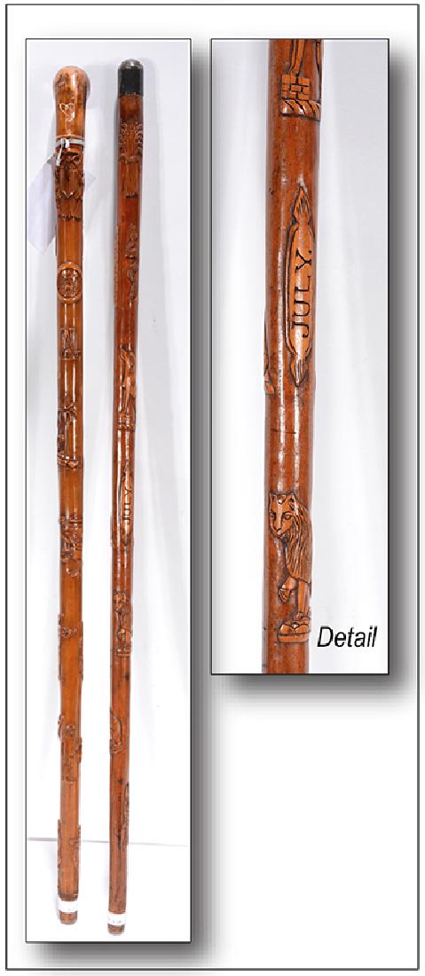 J.A.S. Pair of Presentation Canes.: J.A.S. Pair of Presentation Canes. c. 1890's. Initialed. Carved wood with stylized animals and coat of arms. Great condition. Provenance: Estate of Steward White, The Ames Gallery. 35" h. Est. $800-1,