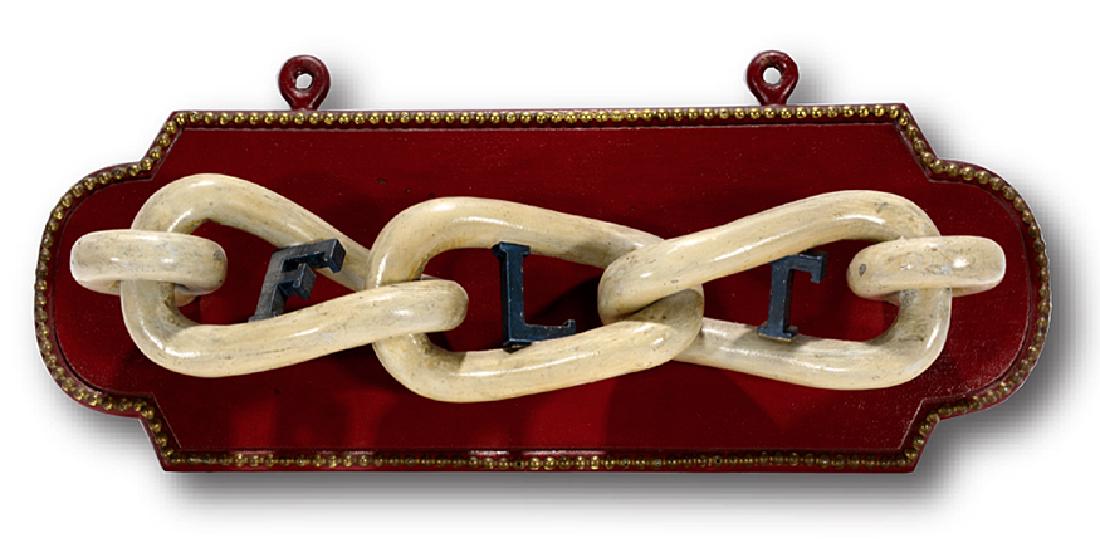 Odd Fellows Lodge Art. Friendship, Love, Truth.: Odd Fellows "The Three Link Fraternity", FLT stands for Friendship, Love and Truth. F.L.T. Carved and painted letters inside wooden chain link. Excellent condition. 20" x 8" x 5". Est. $800-1,200. Shi